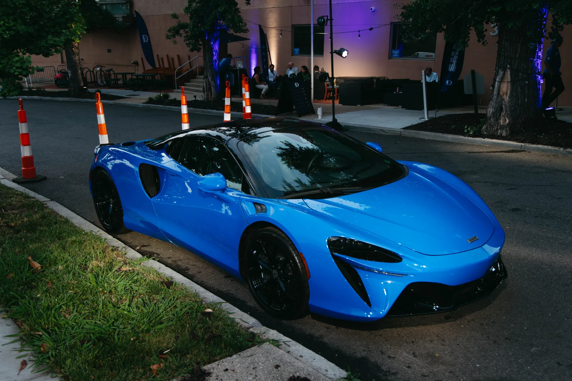 A blue McLaren outside the National Democratic Club event