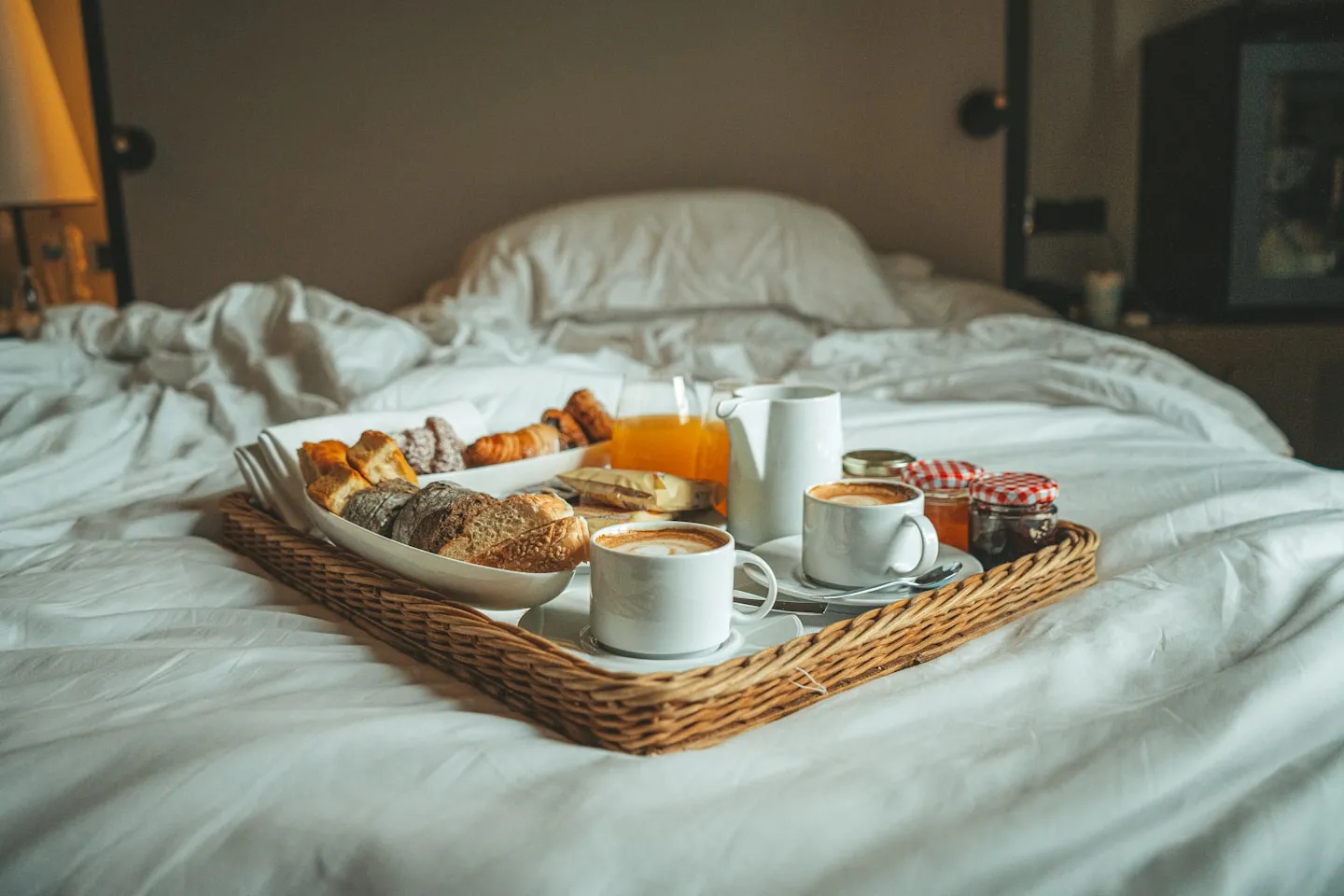 A hotel breakfast tray on white linen